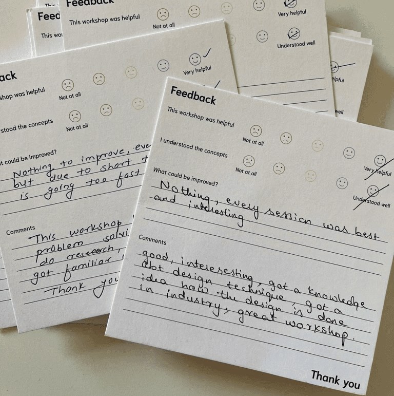 Handwritten feedback cards from workshop participants
